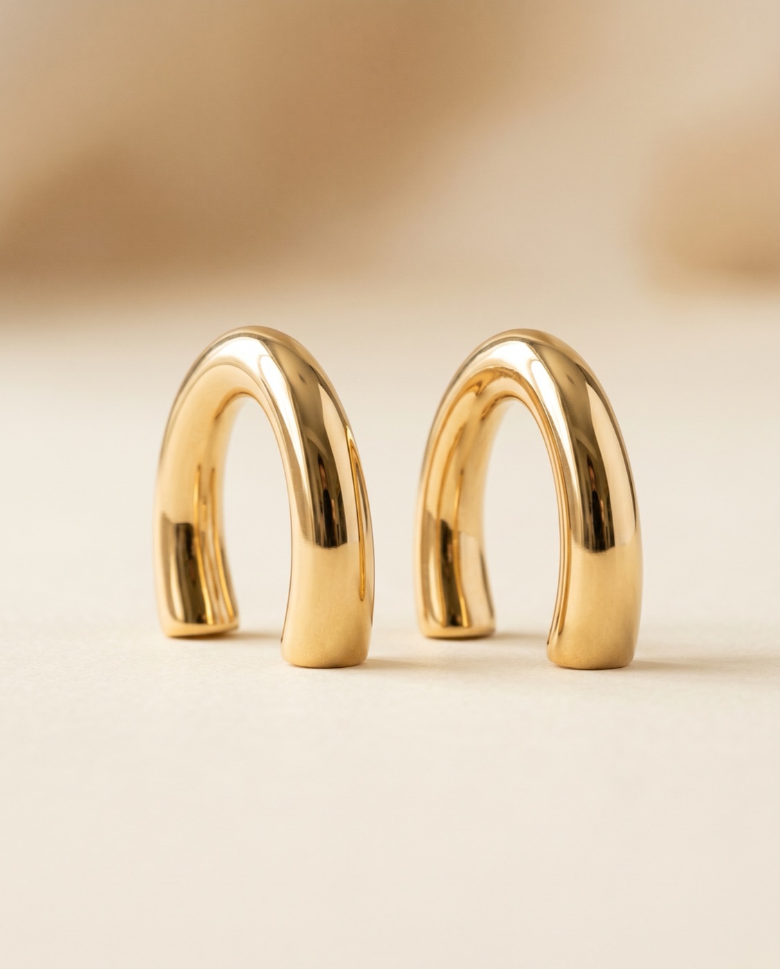 Boucles d'oreilles arc en or 18 carats